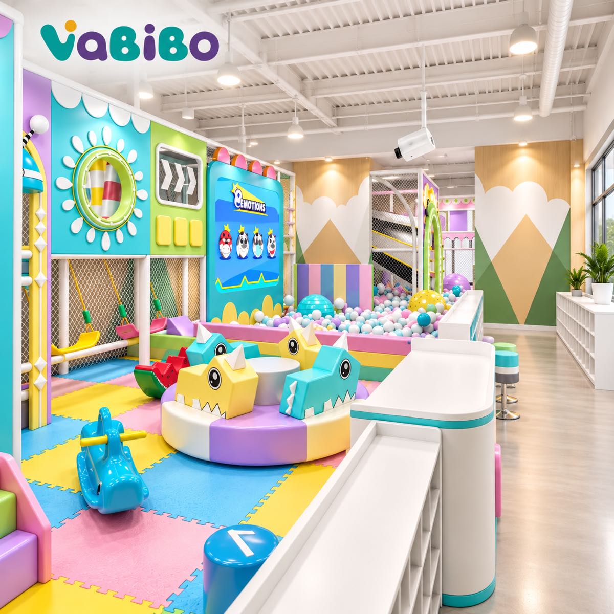 Colorful preschool indoor playground with padded activities and a small supervised ball pool