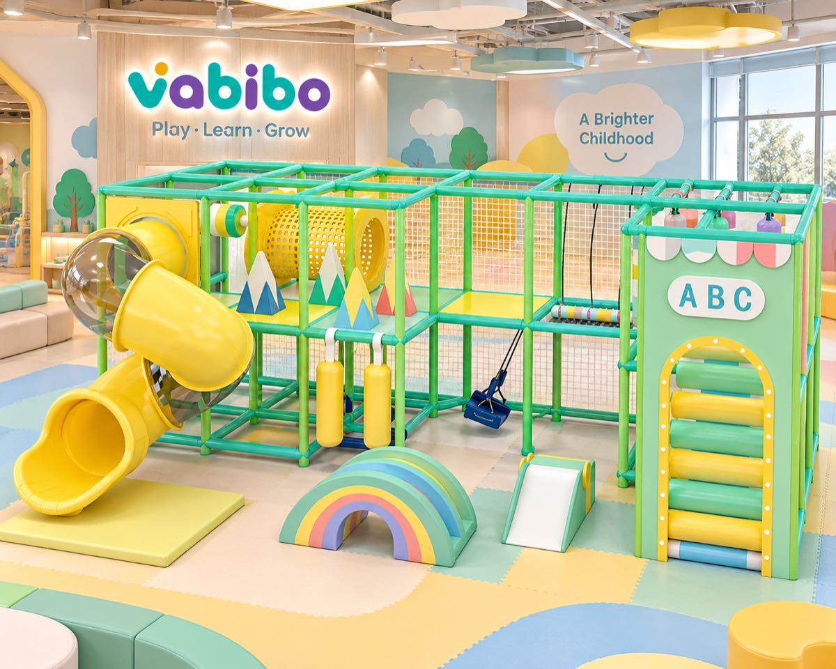 Compact indoor playground for a small commercial venue with a tube slide, swings, and soft play